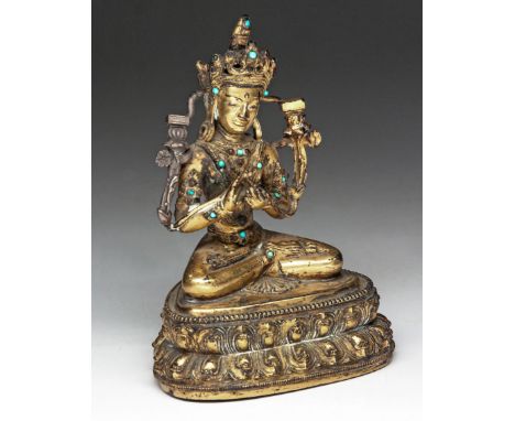 Seated in&nbsp;Dhyanasana&nbsp;on a double-lotus throne with beaded edges, his hands held before him in&nbsp;dharmachakra mud