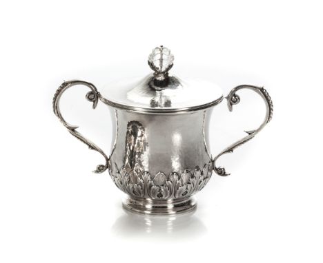 The planished cover with glass bud finial, planished body with beaded leaf-capped opposing handles, acanthus leaf embossed ba