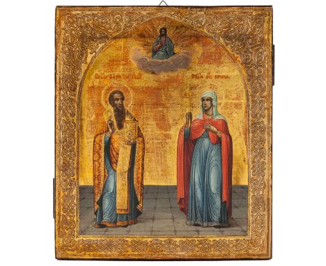 Saint Basil the Great standing with his right hand raised, his left holding a jewel encrusted bible, dressed in a blue robe w