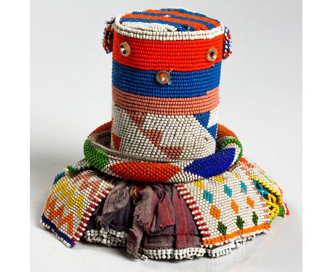 nwana&nbsp;Made from two basic elements, a cylindrical body and a skirt, the cylinder covered in fabric and strings of beads 