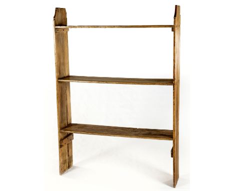 Each open shelf between shaped rectangular supports167cm high, 116cm wide, 27cm deep