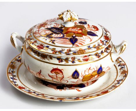 The footed basin and cover painted in the Imari palette, gilt highlights, red painted numerals 2/1127, wear to gilding, 18,5c