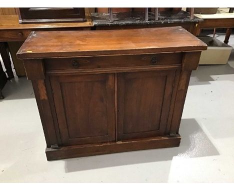 Victorian mahogany Chiffonier with single drawer below and two panelled doors enclosing one fixed shelf standing on plinth ba