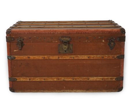 E. Goyard Aine, 233 Rue Saint Honore Paris, a late 19th or early 20th century canvas covered travelling trunk, brass mounted 