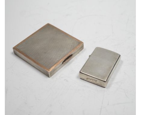 A sterling cased Zippo lighter, 71mm, together with a 1930's engine turned silver cigarette case.