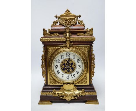 A French oak and brass mounted mantel clock with enamel dial, 42cm high