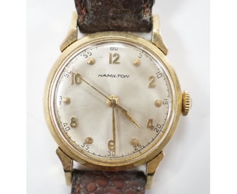 A gentleman's 14k Hamilton manual wind wrist watch, with Arabic dial, on associated leather strap.