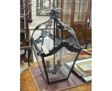 A Victorian style square wrought iron hall lantern, height 70cm