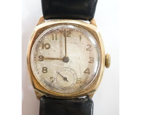 A gentleman's early to mid 20th century 9ct gold manual wind wrist watch, with subsidiary seconds, on a leather strap.
