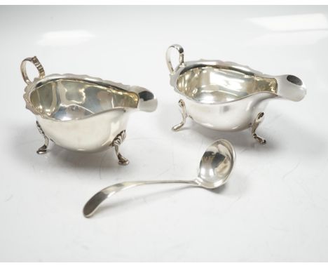 Two mid 20th century silver sauce boats and a similar silver sauce ladle, 8.1oz.