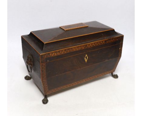 A Regency inlaid rosewood tea caddy, with two canisters, gilt brass handles and claw feet, 20cm high