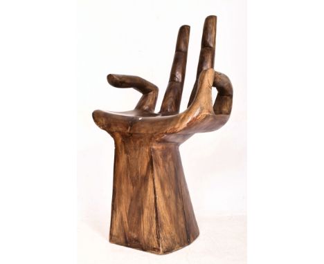 A vintage 20th century carved decorative hardwood occasional side chair / seat in the shape of hand. Figured with three finge