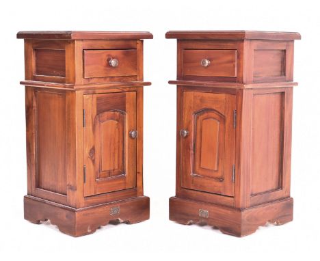 A pair of Victorian manner mahogany bedside cupboards / tables. Each having a squared flared top over drawer and single door 