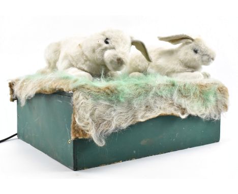 A pair of vintage 20th century 1970s / 80s toy shop / window display articulated bunnies. Each bunny rabbit having articulate