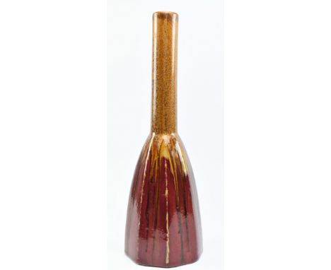 A vintage 20th century brutalist West German style studio art vase. The vase with long cylindrical neck over hexagonal fluted