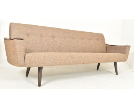 A vintage Danish mid century teak and buttonback upholstered long sofa / settee. The sofa of squared form, featuring polished