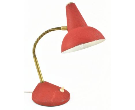 An Italian retro mid 20th century circa 1950s metal gooseneck desk table lamp. The lamp having a conical shade over a brassed
