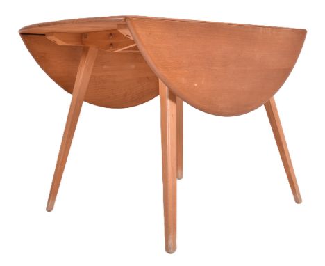 Ercol Furniture - Model 384 - a Windsor beech &amp; elm drop leaf dining table. The table having a circular drop leaf top, al