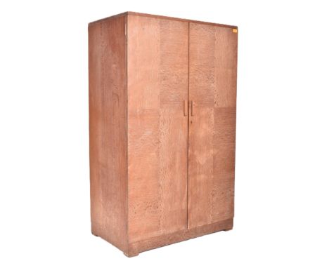 Heals of London - a vintage 20th century 1930s Art Deco limed oak wardrobe. The wardrobe having two full-length doors opening