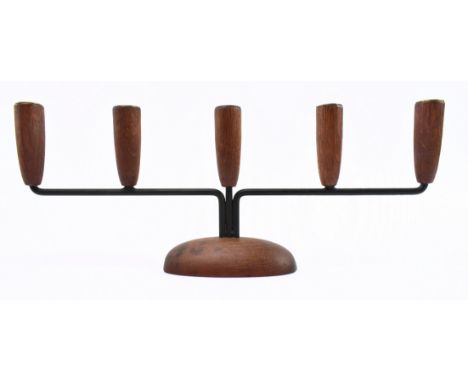 A retro 20th century Danish design candlestick holder. The candlestick having five turned teak holder tops with brass rims su
