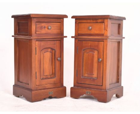Pair of Victorian manner mahogany bedside cupoboards / chests. Each having a squared flared top over drawer and single door c