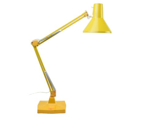 A retro 20th century yellow enamelled metal anglepoise desk table lamp light. The lamp having a conical shade over an articul
