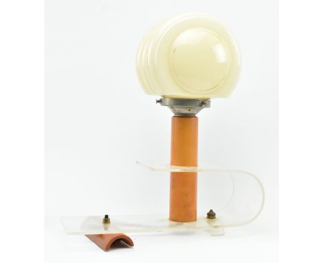 An Art Deco early 20th century circa 1930s perspex and glass desk table lamp light. The lamp having a shaped yellow glass sha