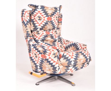 A retro late 20th century Aztec fabric upholstered swivel lounge armchair. The egg chair having a cushioned backrest &amp; se