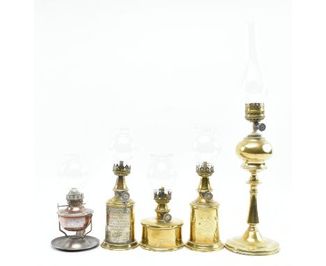 A collection of five French vintage 20th century brass &amp; glass desk table gas lamps. The lot comprising two Lampe Pigeon 