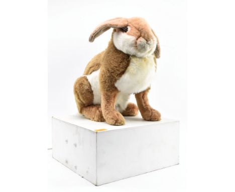 A vintage 20th century 1970s / 80s toy shop / window display articulated hare / rabbit. The hare stood upright upon a white p