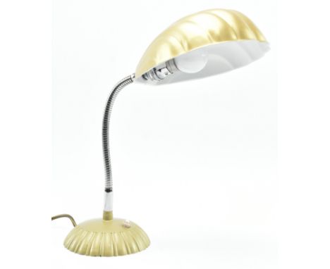 A vintage 20th century Art Deco desk / table lamp light. The lamp having a gold toned shell shade supported upon a chrome goo