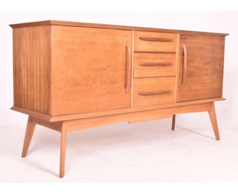 Alfred Cox Furniture - a vintage mid century 1950s / 1960s walnut sideboard. The sideboard featuring three central drawers fl
