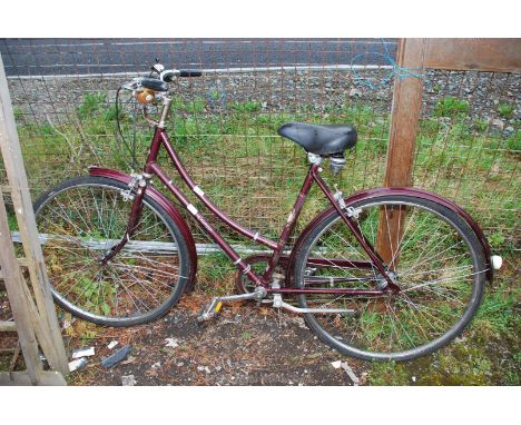 A Raleigh Cameo 3 speed step through bicycle.