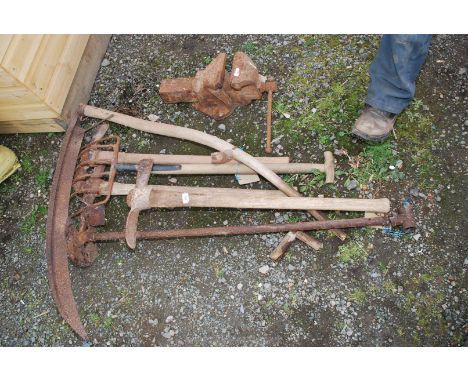 A quantity of tools, pickaxe, scythe etc.