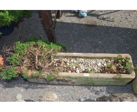 A concrete planter, 36" long.