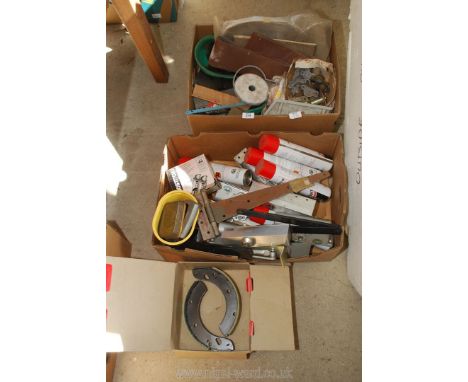 A set of large brake shoes, belt sander paper, Kleer-film cans and door closers