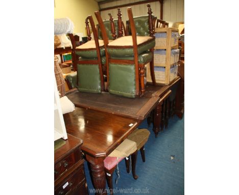 An Edwardian extending dining Table with two spare leaves, extending to 95'' long x 48'' wide and a set of six Rexine covered