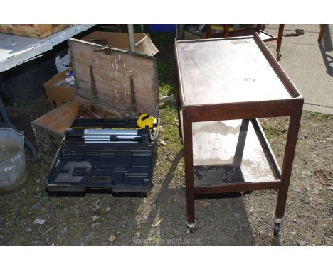 An old wooden tool box with tools, fishing reel etc., and a metal box of screws, plus a boxed level and a tea trolley (only 3