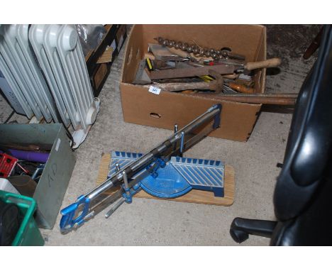 A mitre saw, pipe benders, chisels, files, auger parts etc