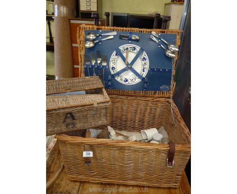 A wicker Optima picnic hamper with contents.