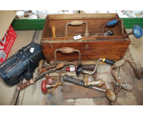 A wooden box and contents of tools, drills and radio.