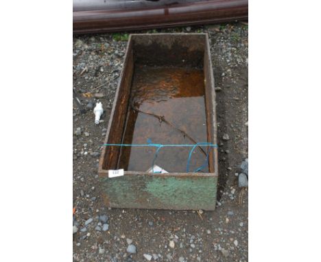 A cast iron trough, 27'' long x 12'' wide x 7'' deep.