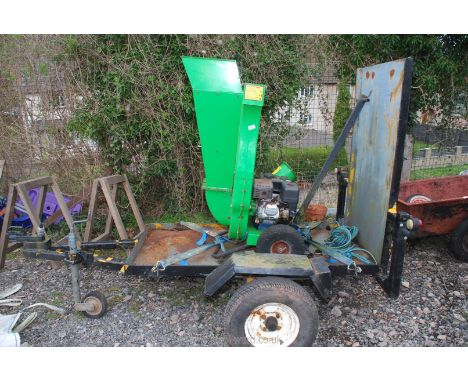 A Woodchipper and trailer, chipper powered by 6.5 gasoline engine, (good compression, engine turns), takes up to 75mm branche