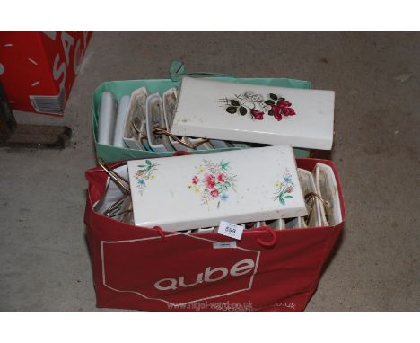 Two bags of radiator panel humidifiers all decorated with flowers.