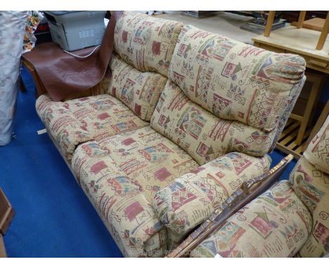 A two seater sofa and matching armchair in Aztec print , both reclining.