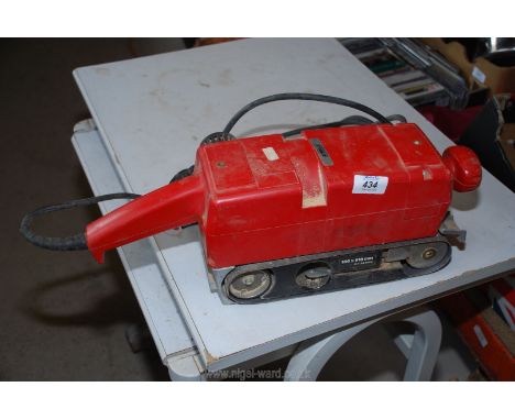 A rotating belt sander, working order but non insulated plug requires replacement.
