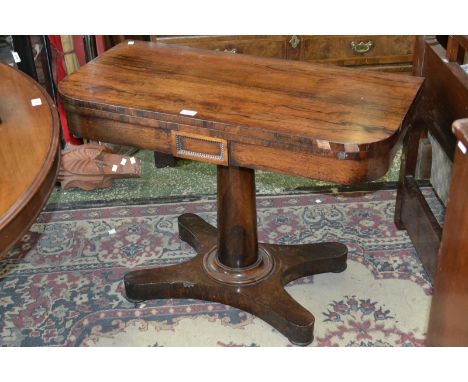 A 19th century rosewood card table, rounded rectangular top enclosing green baize playing area, canon barrel column,circular 