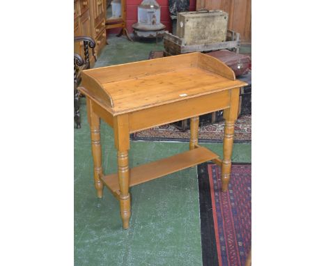 A pine washstand, turned legs, undertier shelf, c.1970's
