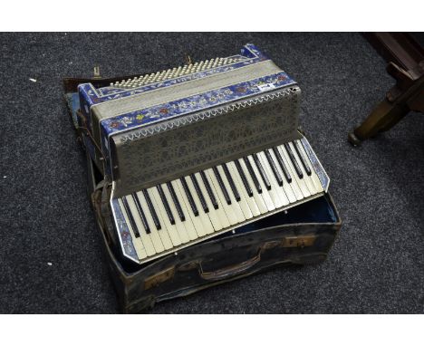 A Soprani Italian piano accordion, blue marbled effect and floral case, with carry case