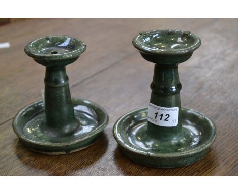 An almost matched pair of ceramic oil lamps